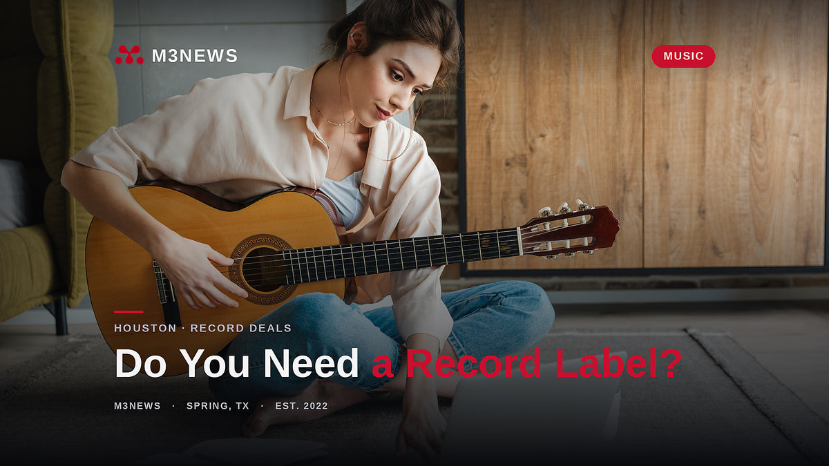 Independent artist with guitar and laptop weighing whether she needs a record label in 2026 Houston